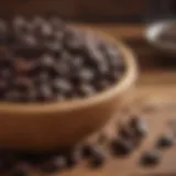 Black coffee beans in a rustic wooden bowl