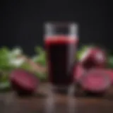 Vibrant glass of organic beet juice with fresh beetroots