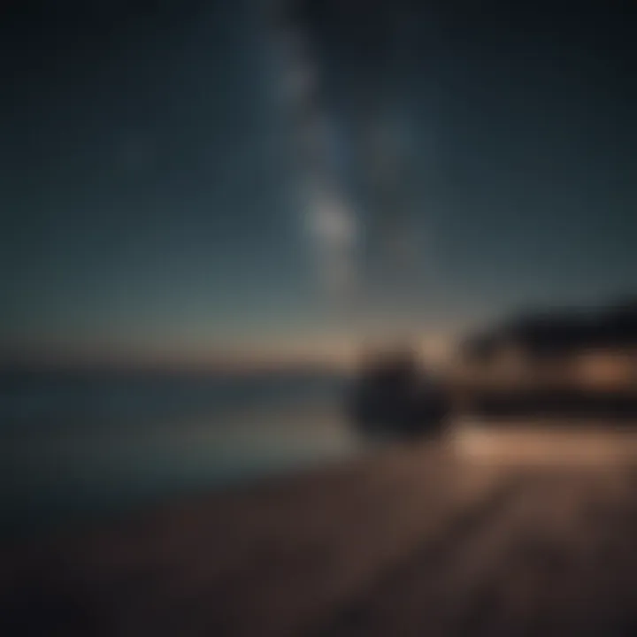 Couple sitting on a pier looking out at the sea under the stars