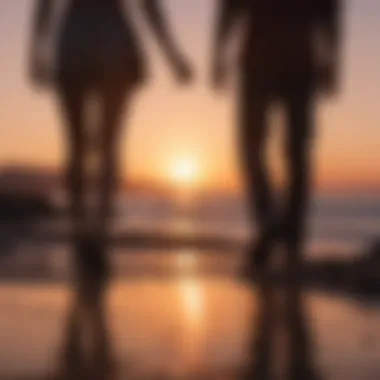 Silhouettes of a couple walking hand in hand at sunset