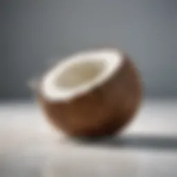 Refreshing coconut water in a glass with pieces of coconut