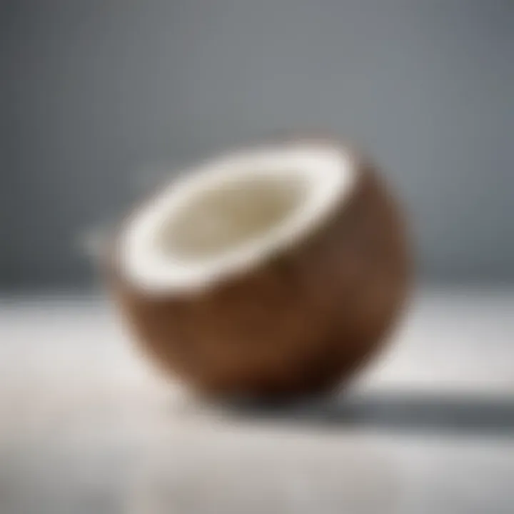 Refreshing coconut water in a glass with pieces of coconut