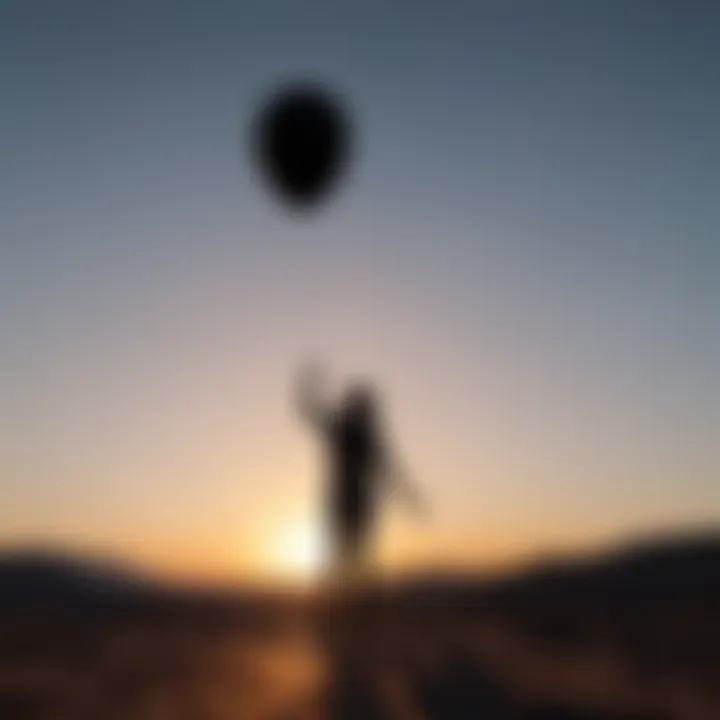 Silhouette of a person letting go of a balloon symbolizing emotional release