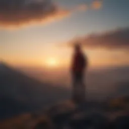 Silhouette of a person standing alone on a mountaintop at sunset