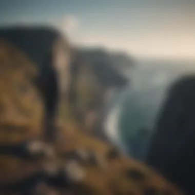 Facing the Unknown Person standing at the edge of a cliff looking towards the horizon