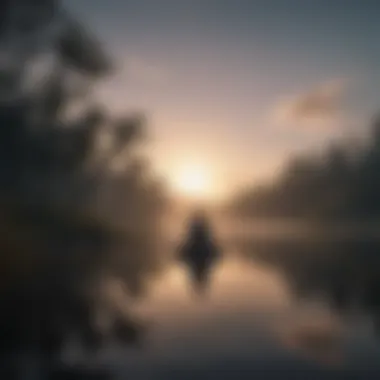 Serenity in Nature Silhouette of person meditating by a tranquil lake